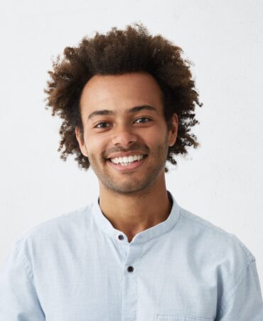 cheerful-african-guy-with-narrow-dark-eyes-and-flu-BL5NRS3.jpg